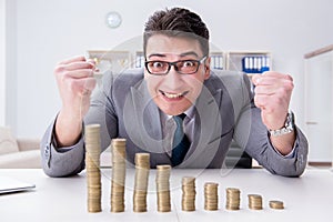 The businessman with golden coins in business growth concept