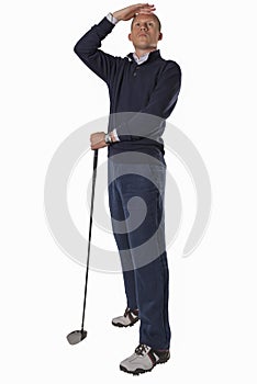 Businessman golfing isolated on white background