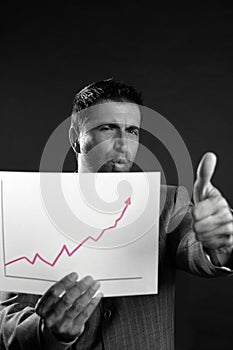 Businessman with good sales reports graph