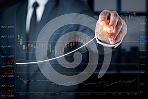 Businessman with a graph showing the ups and downs of stock. Concept of doing an online business called stock trading. Business