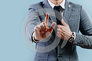 Businessman in suit making objection gesture , holding index finger up over blue photo