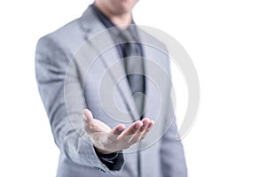 Businessman in gray suit is showing something in his empty palm