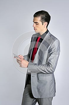 Businessman with gray suit talking cellular