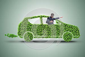 The businessman in green electric car concept