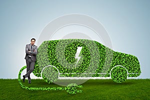 The businessman in green electric car concept