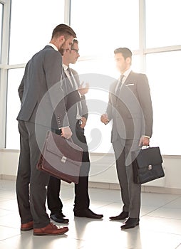 A businessman greeting clients