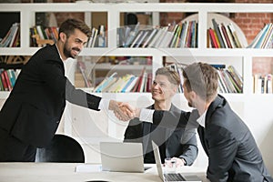 Businessman greeting welcoming new partner or making deal with h