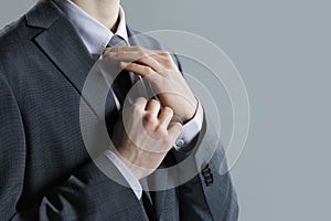 A businessman in a grey suit