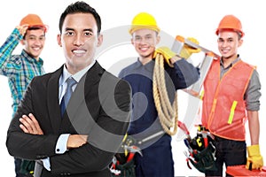 Businessman with group of professional male engineer at the back