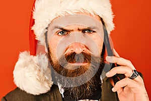 Businessman with grumpy face in close up. Man with beard