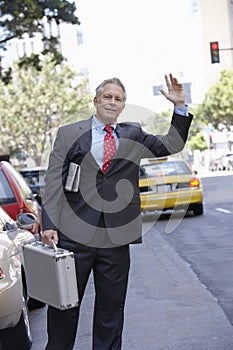 Businessman Hailing A Cab