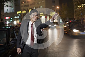 Businessman Hailing Taxi Cab