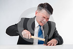 Businessman with hammer