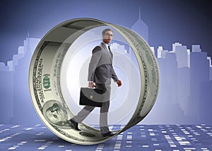 The businessman in hamster wheel chasing dollars photo