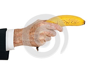 Businessman hand with banana like gun, over white
