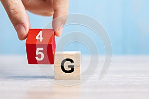 Businessman hand change wooden block from 4G to 5G. Technology, network, communication concept