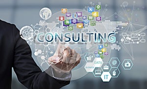 Businessman hand chooses Consulting wording on interface screen.