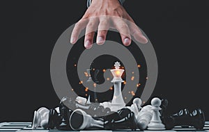 Businessman hand Control with chess game. concept of business strategy and tactic.strategy, management or leadership concept