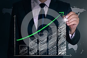 Businessman hand draw a positive graph