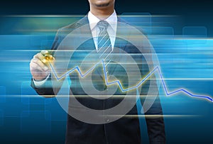 Businessman hand drawing business graph
