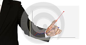 Businessman hand drawing a graph