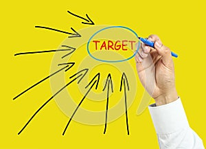 Businessman hand drawing target concept