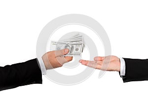 Businessman hand handing over money to another hand  on white background