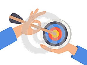 Businessman hand hold target with arrow hit bullseye. Goal or target, focus and concentration to achieve success