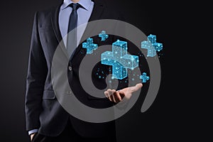 Businessman hand holding 3D plus low polygonal icon.Plus sign virtual means to offer positive thing like benefits, personal