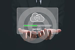 Businessman hand holding backup icon on virtual screen