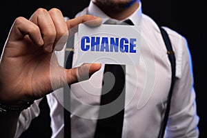 Businessman hand holding card with CHANGE word. success, strategy, solution, business and Positive thinking concepts