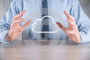 Businessman hand holding cloud.Cloud computing concept, close up of young business man with cloud over his hand.The concept of