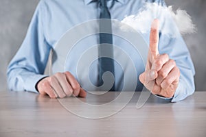 Businessman hand holding cloud.Cloud computing concept, close up of young business man with cloud over his hand.The concept of