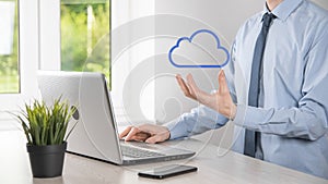 Businessman hand holding cloud.Cloud computing concept, close up of young business man with cloud over his hand.The concept of