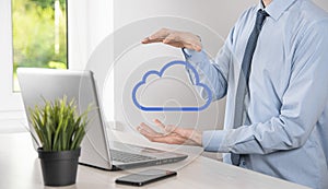 Businessman hand holding cloud.Cloud computing concept, close up of young business man with cloud over his hand.The concept of