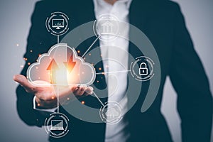 Businessman hand holding a cloud networking concept and touch screen with hand connection line on the black background, Cloud comp