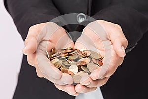 Businessman hand holding the coins, concept of saving  money for finance accounting