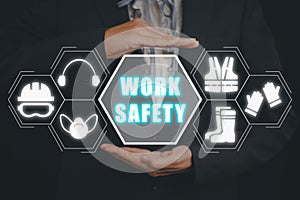 Businessman hand holding holographic VR screen work safety icon, First secure rules. Health protection,