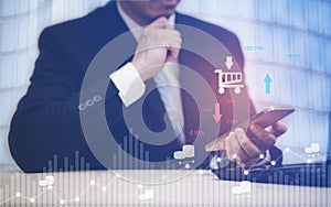 Businessman hand holding mobile phone, Digital Composite Image Of user Using Laptop With shopping online concept, data protection