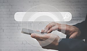 Businessman hand holding the mobile screen, Mockup cell mobile smartphone in a suit holds a mobile phone with blank white screen