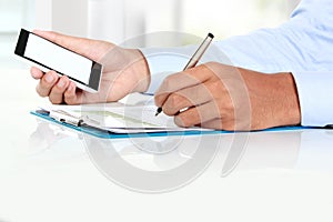 Businessman Hand holding mobile smart phone with blank screen