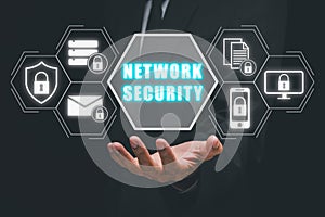 Businessman hand holding network security icon on virtual screen