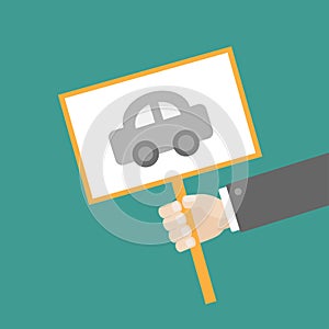 Businessman hand holding paper blank sign plate with car on the stick Flat design