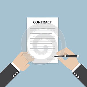 Businessman hand holding pen and signing business contract