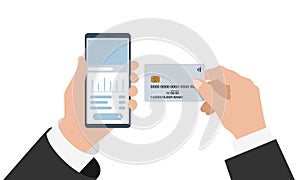 Businessman hand holding smartphone with online banking mobile app and credit card. Buy payment process and bank account