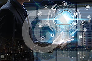 Businessman hand holding with virtual cloud computing icon over the Network connection, Cyber Security Data Protection Business
