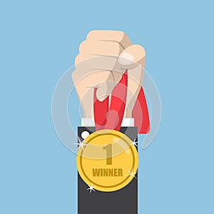 Businessman hand holding winner medal