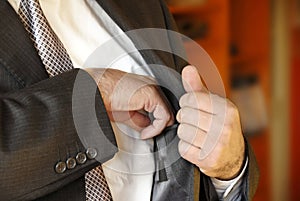 Businessman hand in inner pocket