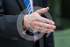 Businessman hand just before a handshake