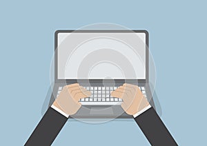 Businessman hand on laptop keyboard with blank screen monitor